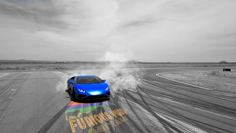A blue Lamborghini drifting, with the Furious Pugs Aerials logo on the track