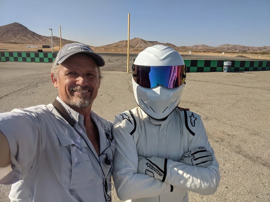 Russell with the Stig on the track at Top Gear America