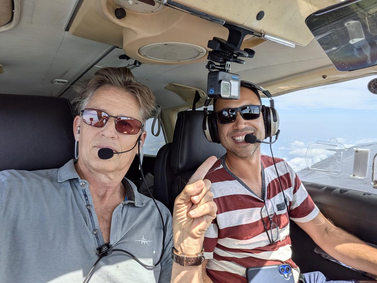 Russell in the cockpit with a student