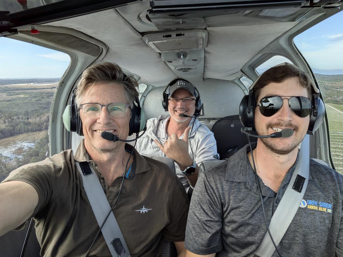 Russell in the cockpit with a student