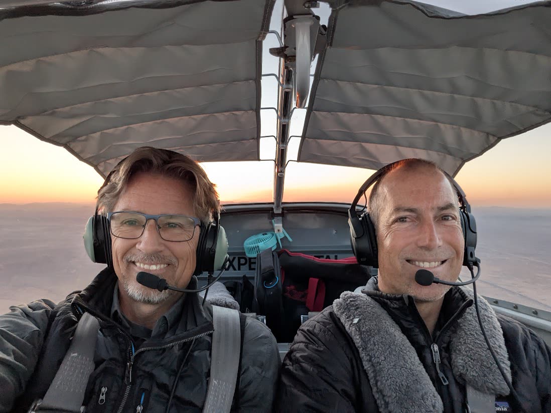 Russell in the cockpit with a student