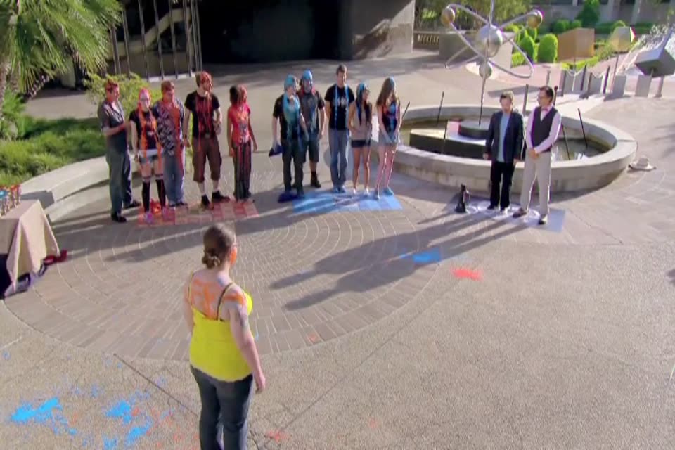 Contestants lined up in a courtyard