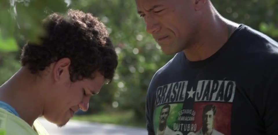 Dwayne Johnson with a young athlete